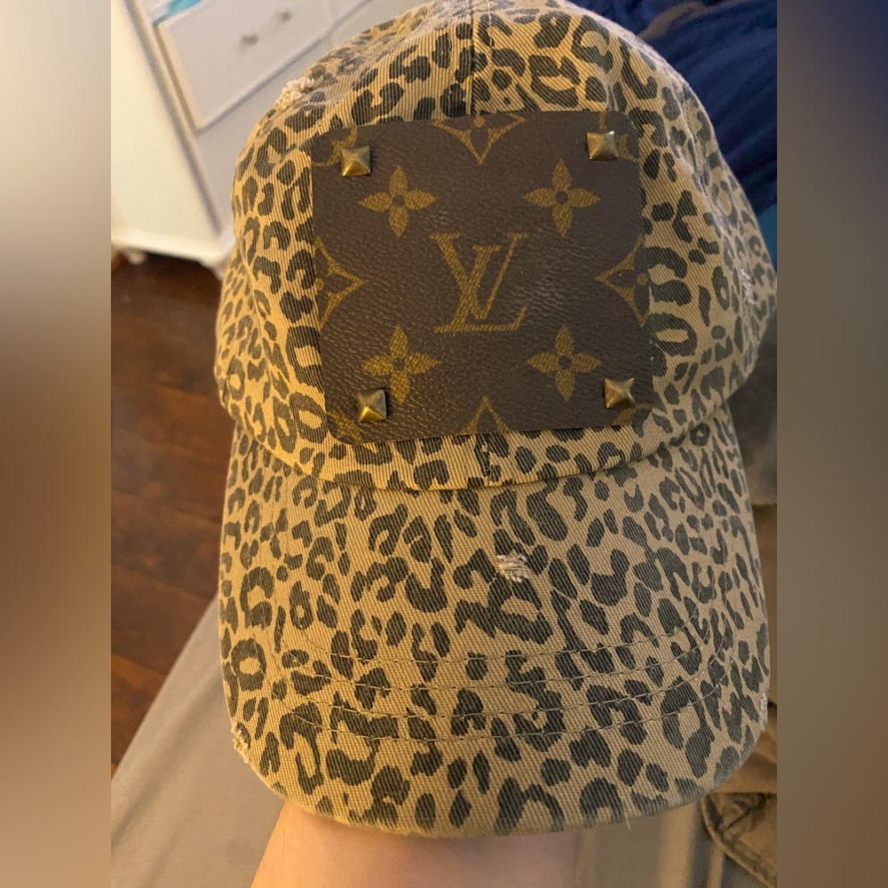 Upcycled baseball cap with leopard print background